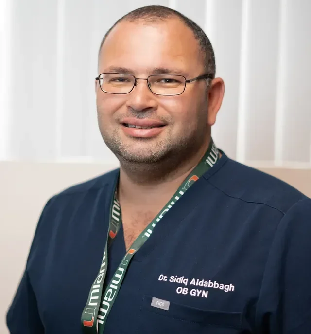 Dr. Sidiq Aldabbagh wearing medical scrubs, OB-GYN - Trusted Women’s Health Center