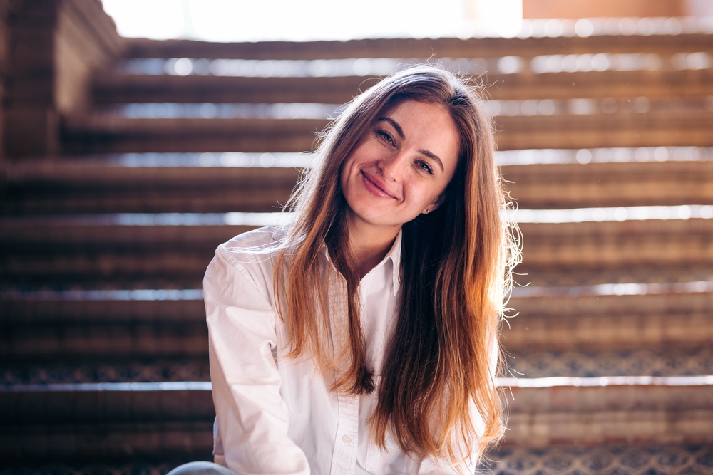 Smiling woman representing compassionate care – trusted women's health center